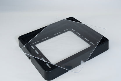 Clear acrylic sheet on a black ASA frame against a white background